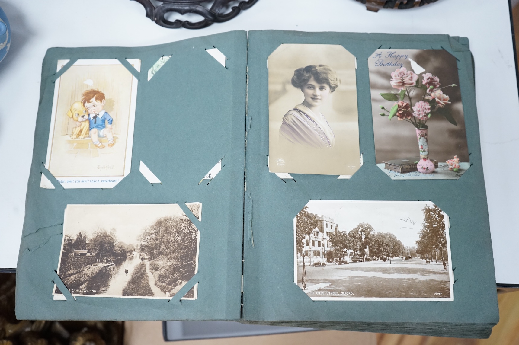 A postcard album to include greetings cards and topographical examples
